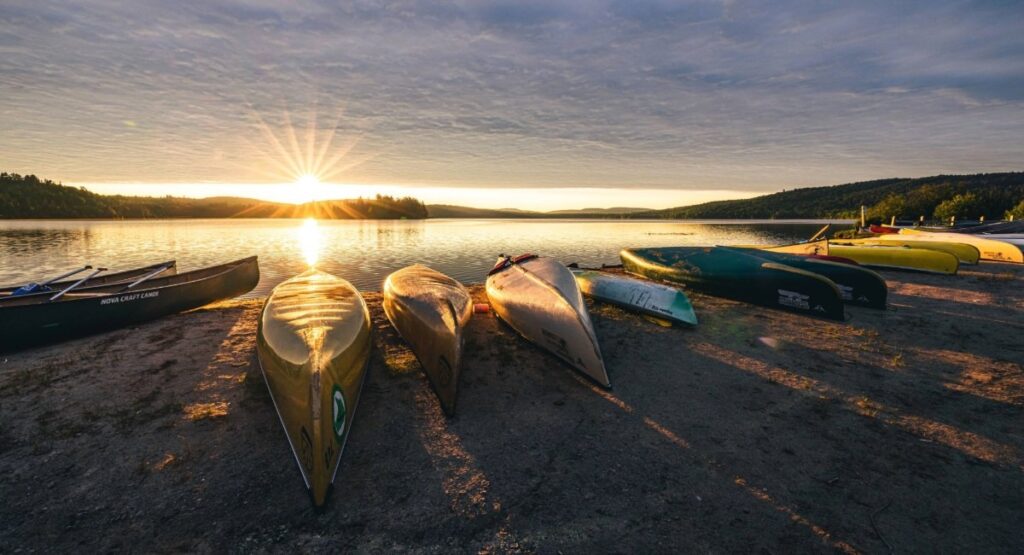 Canoes lined up at Lake of Two Rivers in Algonquin Park at sunrise popular campground and wildlife viewing area
